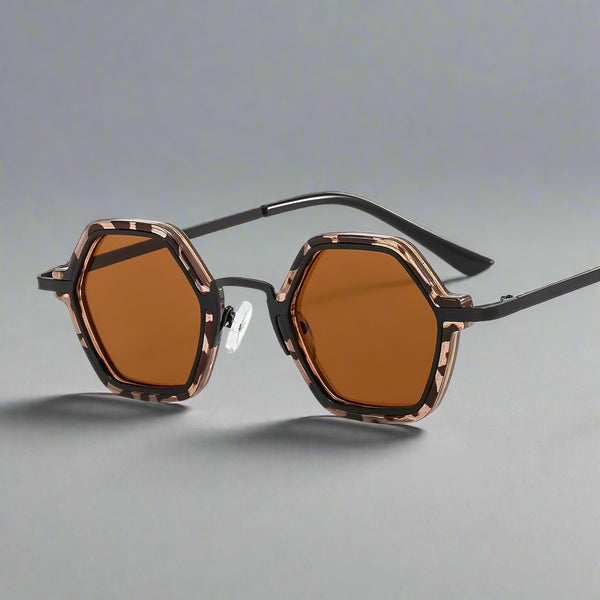 Sunglasses with a tortoiseshell frame and brown lenses on a white background
