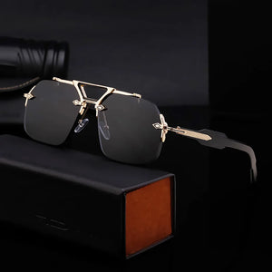 Black sunglasses with gold accents on a dark background