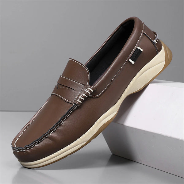 Brown leather loafer shoe on a gray background