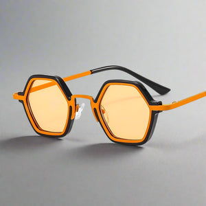 Sunglasses with orange frames and yellow-tinted lenses on a white background