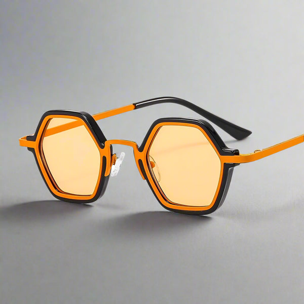 Sunglasses with orange frames and yellow-tinted lenses on a white background