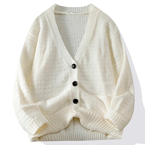 White knitted cardigan with black buttons on a white background