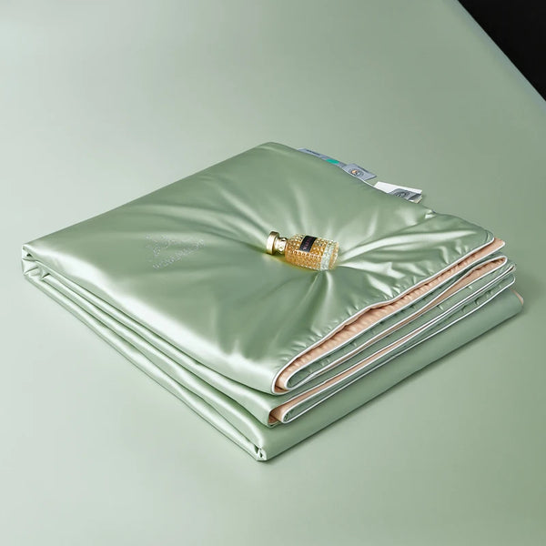 Folded green blanket with a bottle on a light green background