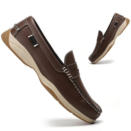 Brown loafers with beige soles on a white background