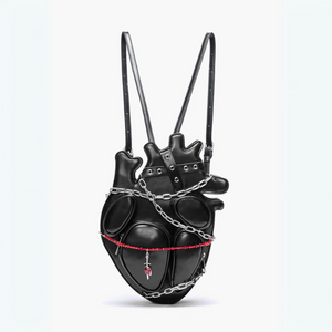 Black heart-shaped backpack with chain details on a white background