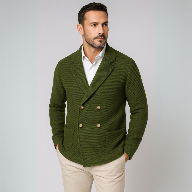 Man wearing a green blazer over a white shirt on a light gray background