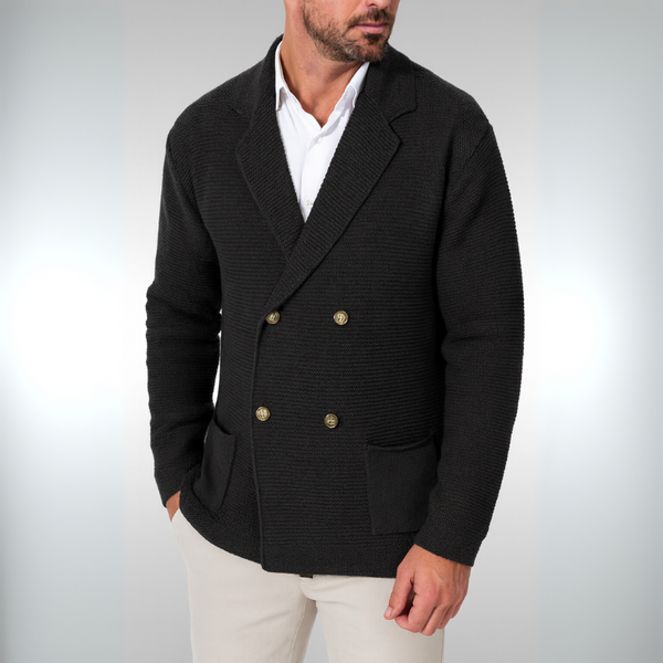 Man wearing a black double-breasted blazer with gold buttons on a white background