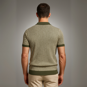 Man wearing a green and beige striped sweater against a gray background