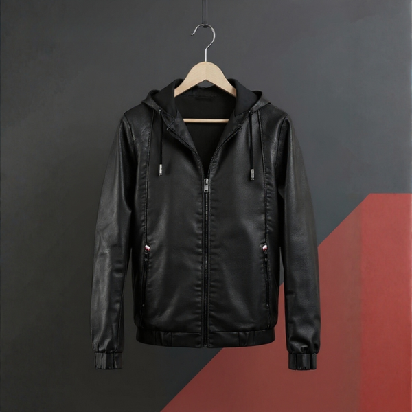 Black leather jacket on a hanger against a dark background
