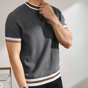 Gray ribbed knit t-shirt with white and brown stripes worn by a person against a neutral background