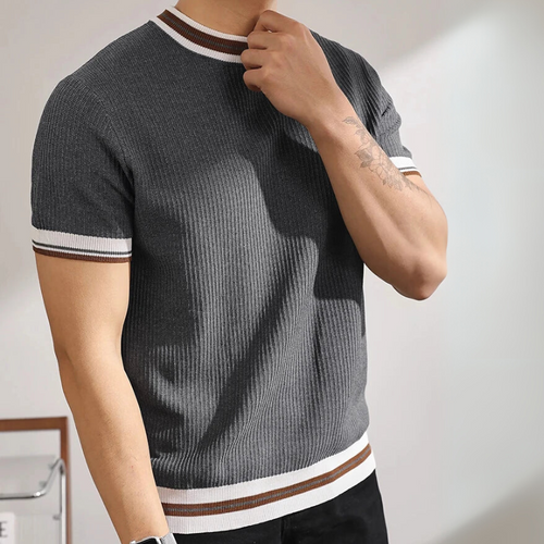 Gray ribbed knit t-shirt with white and brown stripes worn by a person against a neutral background